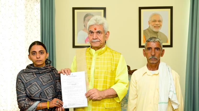 LG Manoj Sinha hands over appointment letter to s...