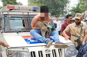 Thief paraded on streets with garland of shoes in...