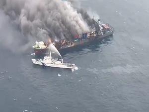 Indian Coast Guard working to combat fire on Sing...