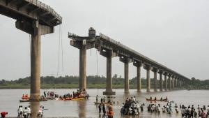 Eight killed as vehicles fall into river after br...