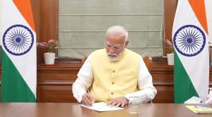 On first day in office as 3rd time PM, Modi signs...