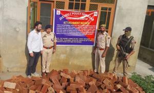 Srinagar Police attaches property worth Rs 1.5 cr...