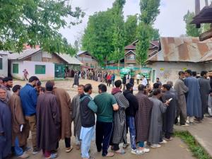 Voters queue up in Srinagar to vote for the first...