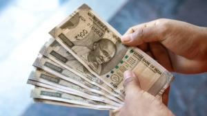 Rupee sinks 38 paise to 87.33 against US dollar; ...